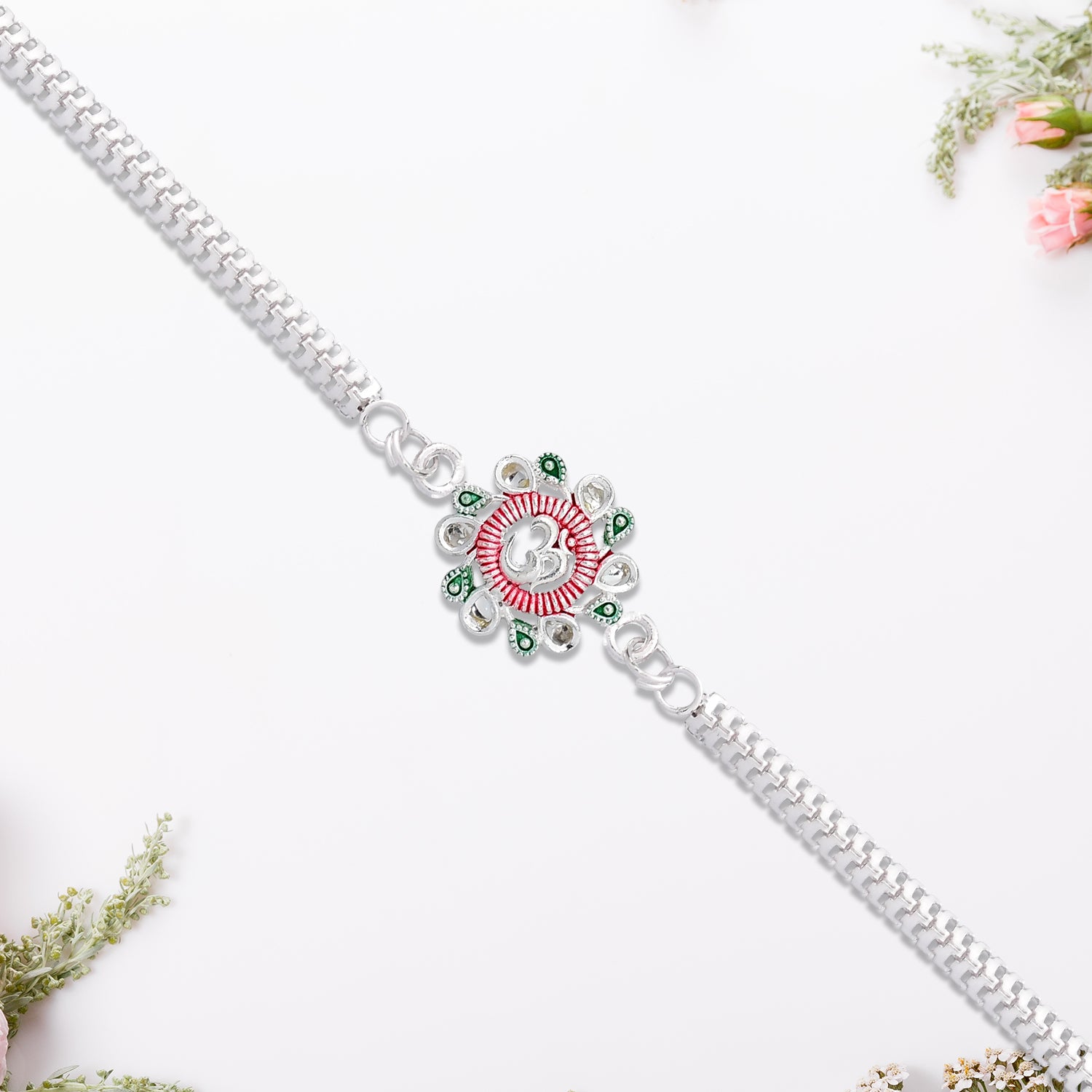 Elegant Floral Om Rakhi With Pink-green Accents Elegant Floral Om Rakhi With Pink-green Accents